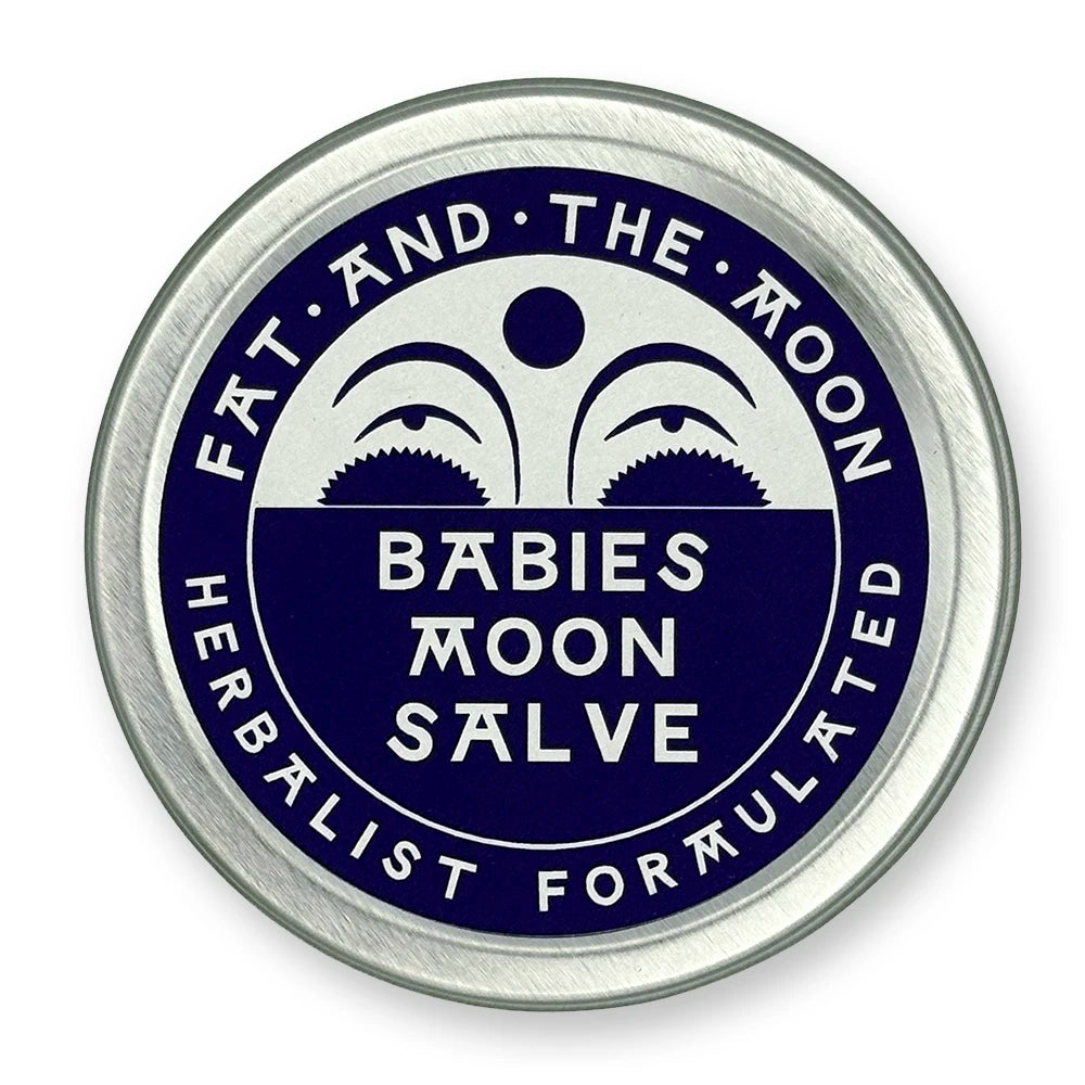 Round metal container with dark purple label and half-moon face.
