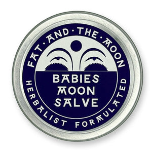 Round metal container with dark purple label and half-moon face.