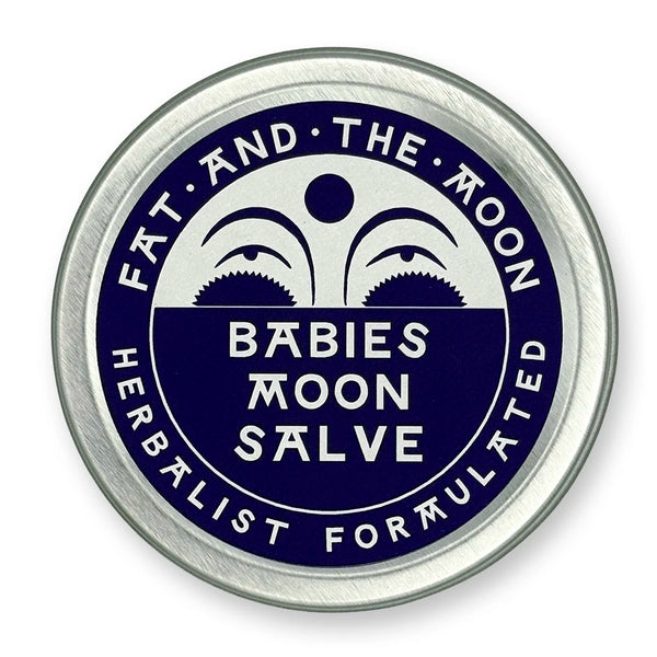 Round metal container with dark purple label and half-moon face.