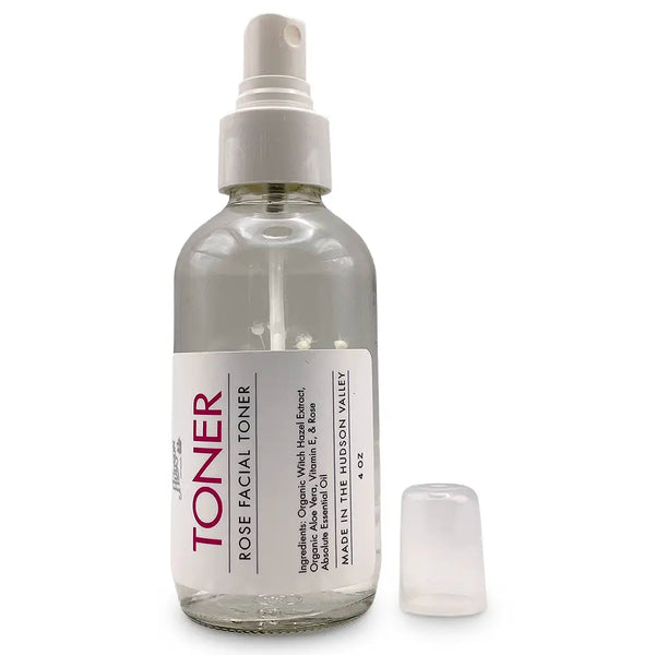 Ingredients: Organic Witch Hazel Extract, Organic Aloe Vera, Vitamin E, & Rose Absolute Essential Oil. Made in the Hudson Valley. 4 Oz.
Clear spray bottle with white flower/plant inside and white label.