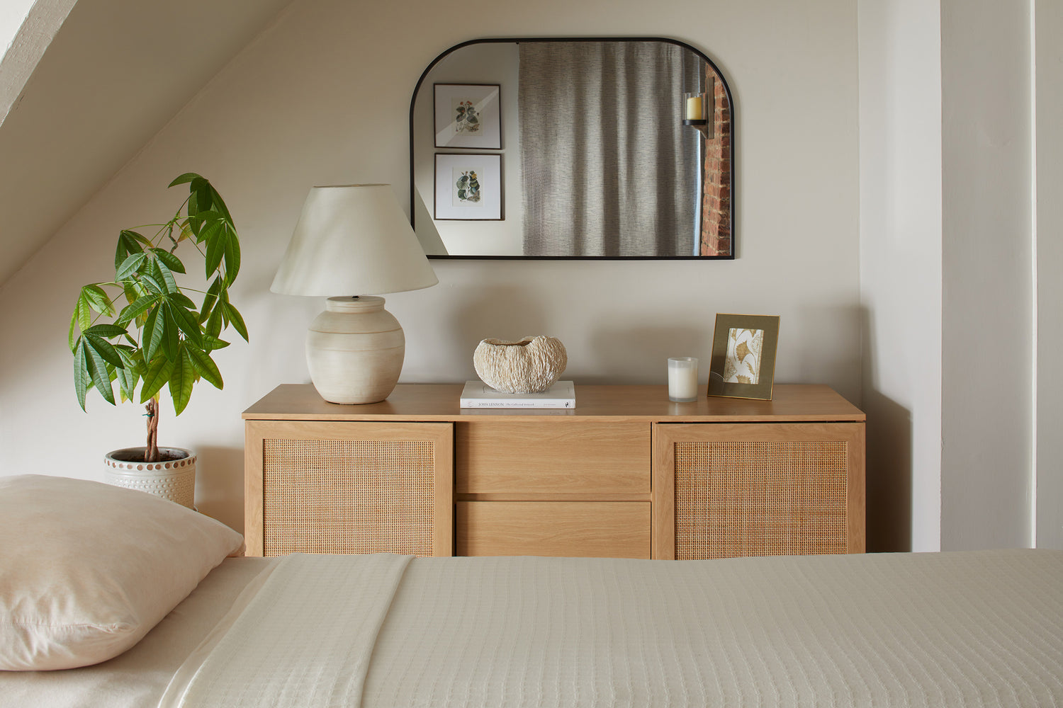 A Jennifer Layne treatment room containing credenza, mirror, and acupuncture bed