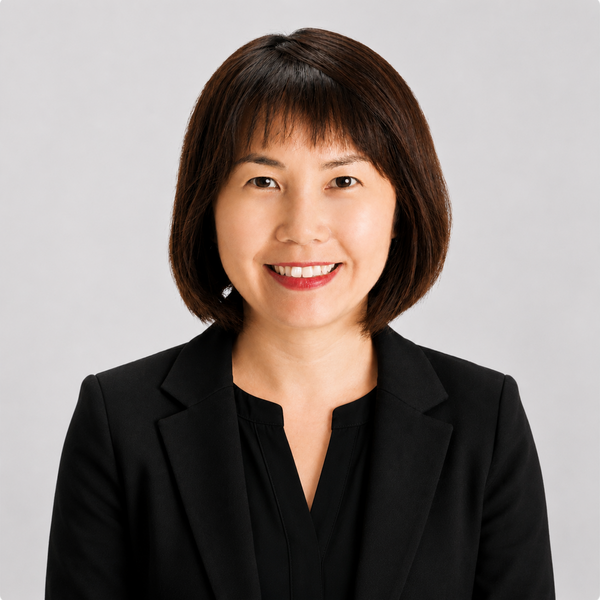 Headshot of Erica Hong, smiling, wearing a black shirt and jacket.