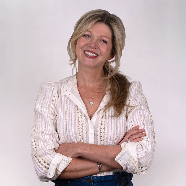 Headshot of Jennifer Layne McDonald, smiling, wearing a white shirt.