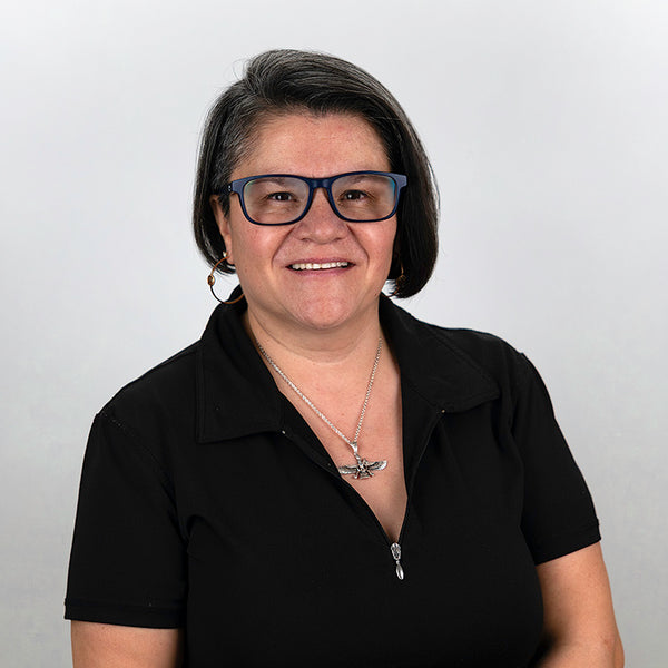 Headshot of Nancy Raza, smiling, wearing a black shirt.