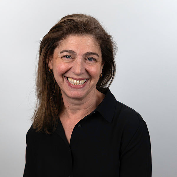 Headshot of Perri Nunziato, smiling, wearing a black shirt.
