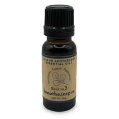 Dark bottle with a black cap and beige label. Eucalyptus, Cyprus, Peppermint. Blend no.3. Net Wt. 15 ML.