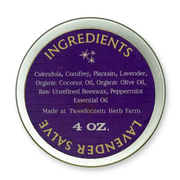 Back of round metal container of 4 oz  lavender salve which includes ingredients on a purple background.