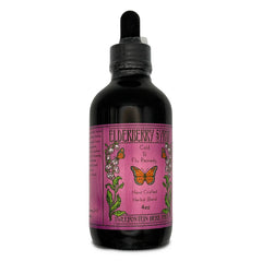 Front of dark bottle with dropper cap and pink/purple label with orange butterflies.
