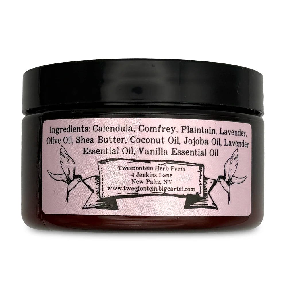 Dark round container with black lid and lavender label with bee illustrations at the top.